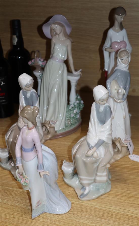 A Lladro girl with a straw hat, girl with a heart, two seated pheasant girls, girl with lamb and girl with basket (6)